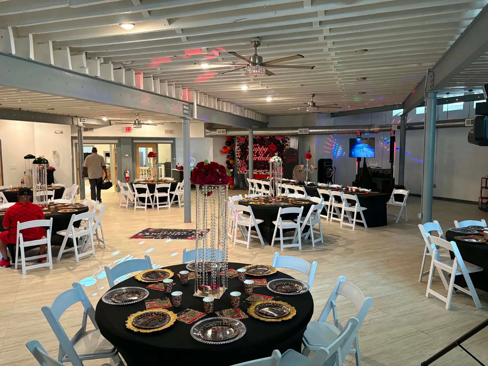 The Sanctuary social hall set with decorated tables for a celebration